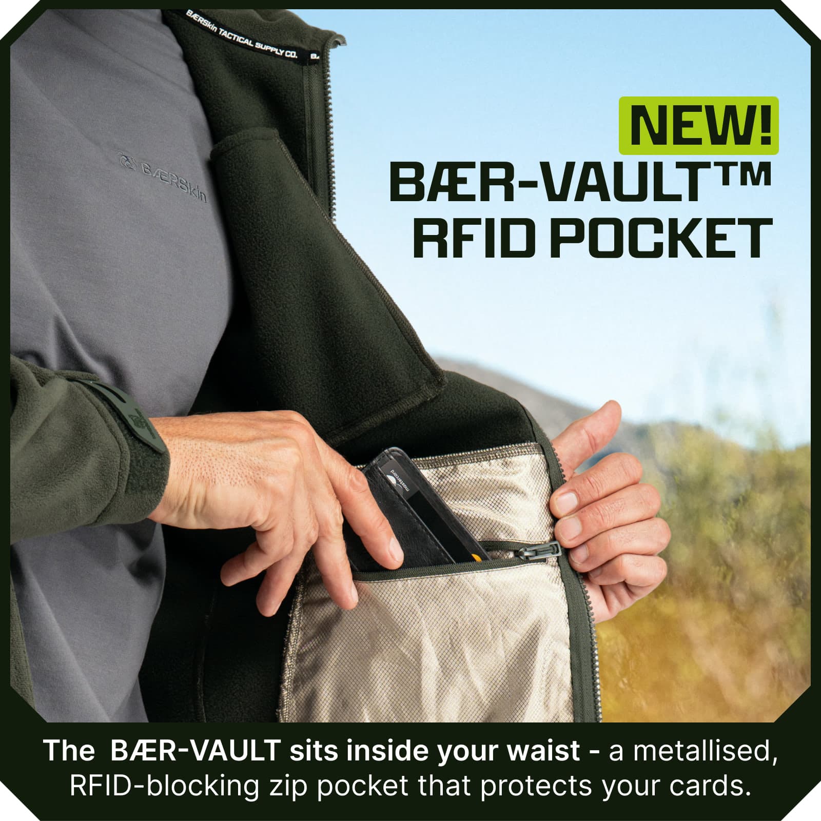 Man placing a card into the interior zippered RFID-blocking pocket of a green fleece jacket