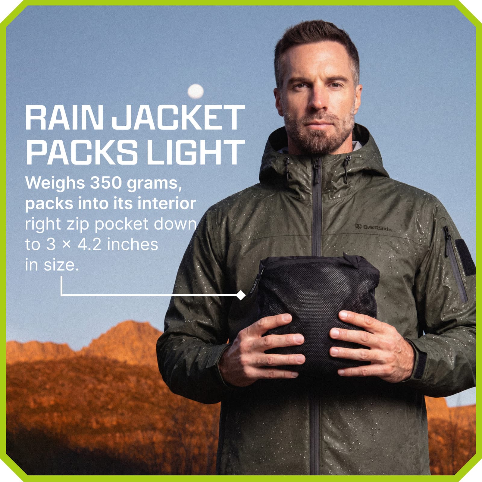 Man wearing green BAERSkin rain jacket holds it packed into small pouch, weighing 350 grams