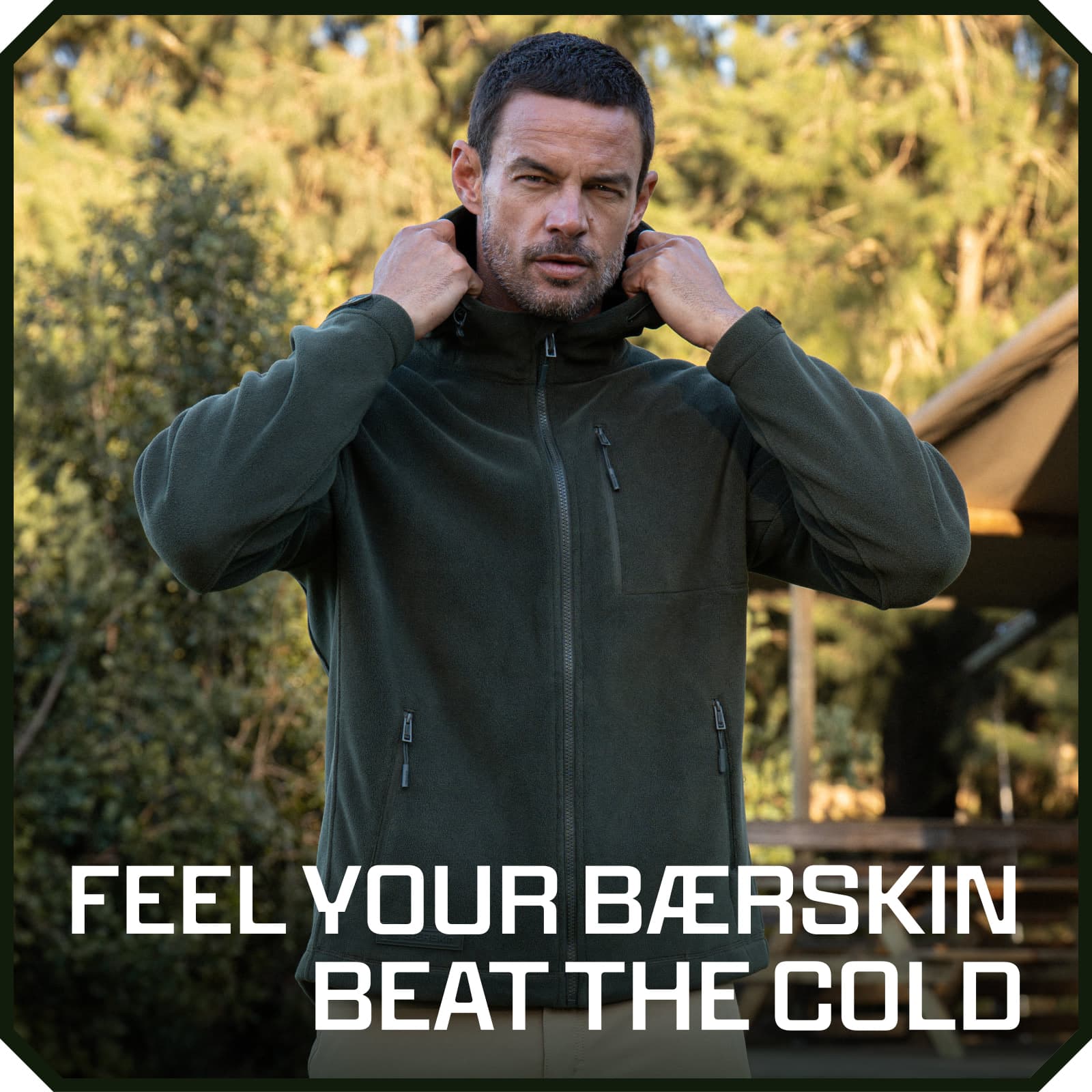 Man wearing olive green fleece hooded jacket with zip pockets, adjusting hood outdoors