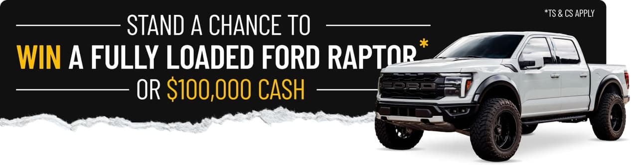 A white Ford Raptor pickup truck beside torn dark paper